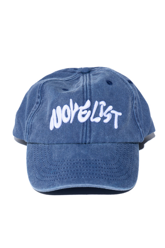 Designed by Novelist Studios to create a perfect baseball cap. Exclusive Novelist logo. Side Blue/white 1